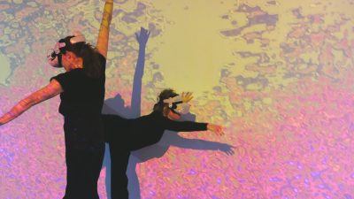 VR dancing in front of projection