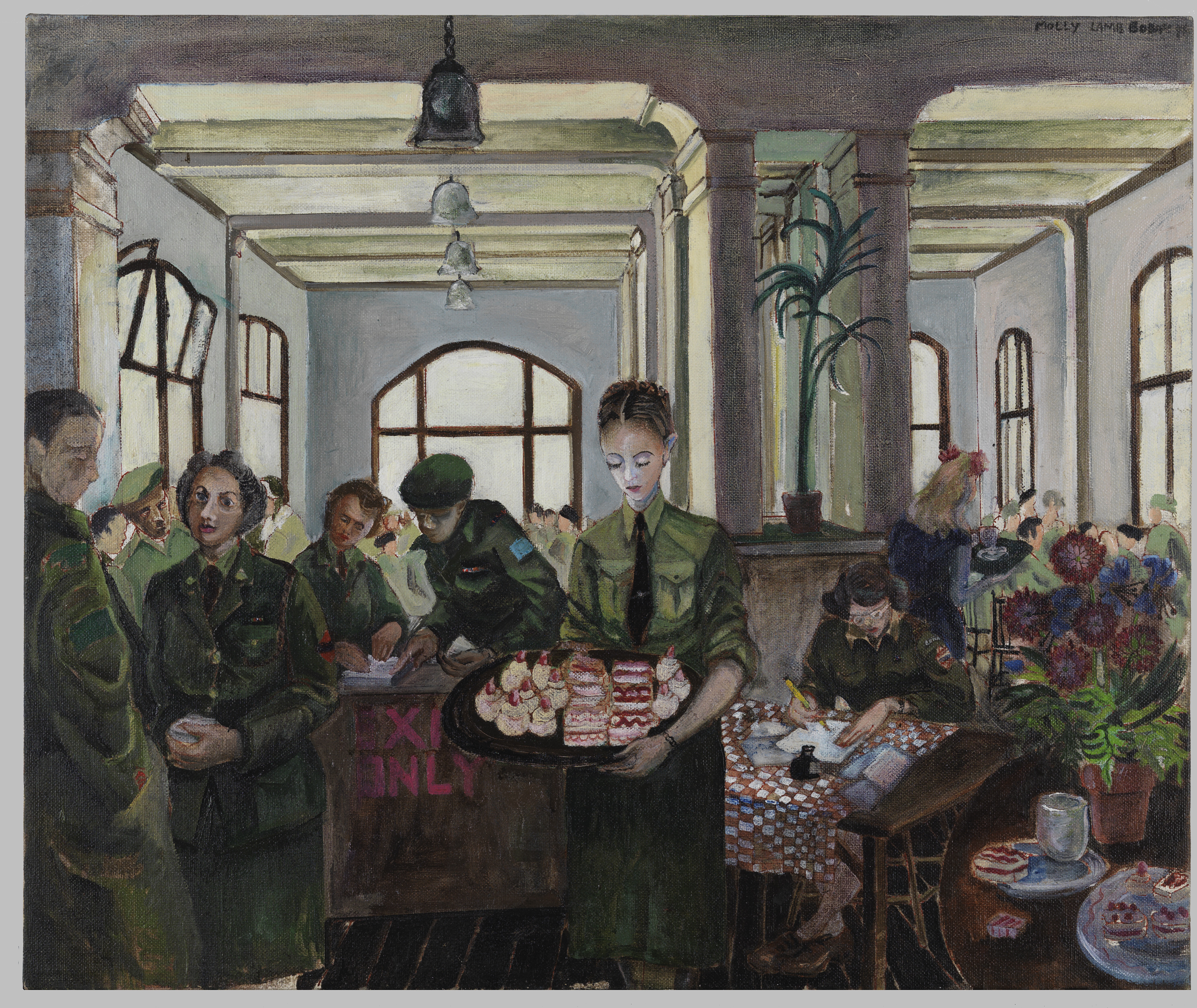 Women in green military uniforms gather in a bright room with tall windows, one carrying a tray of desserts while another writes at a table.