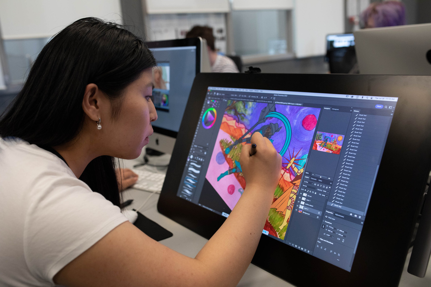student drawing on a tablet