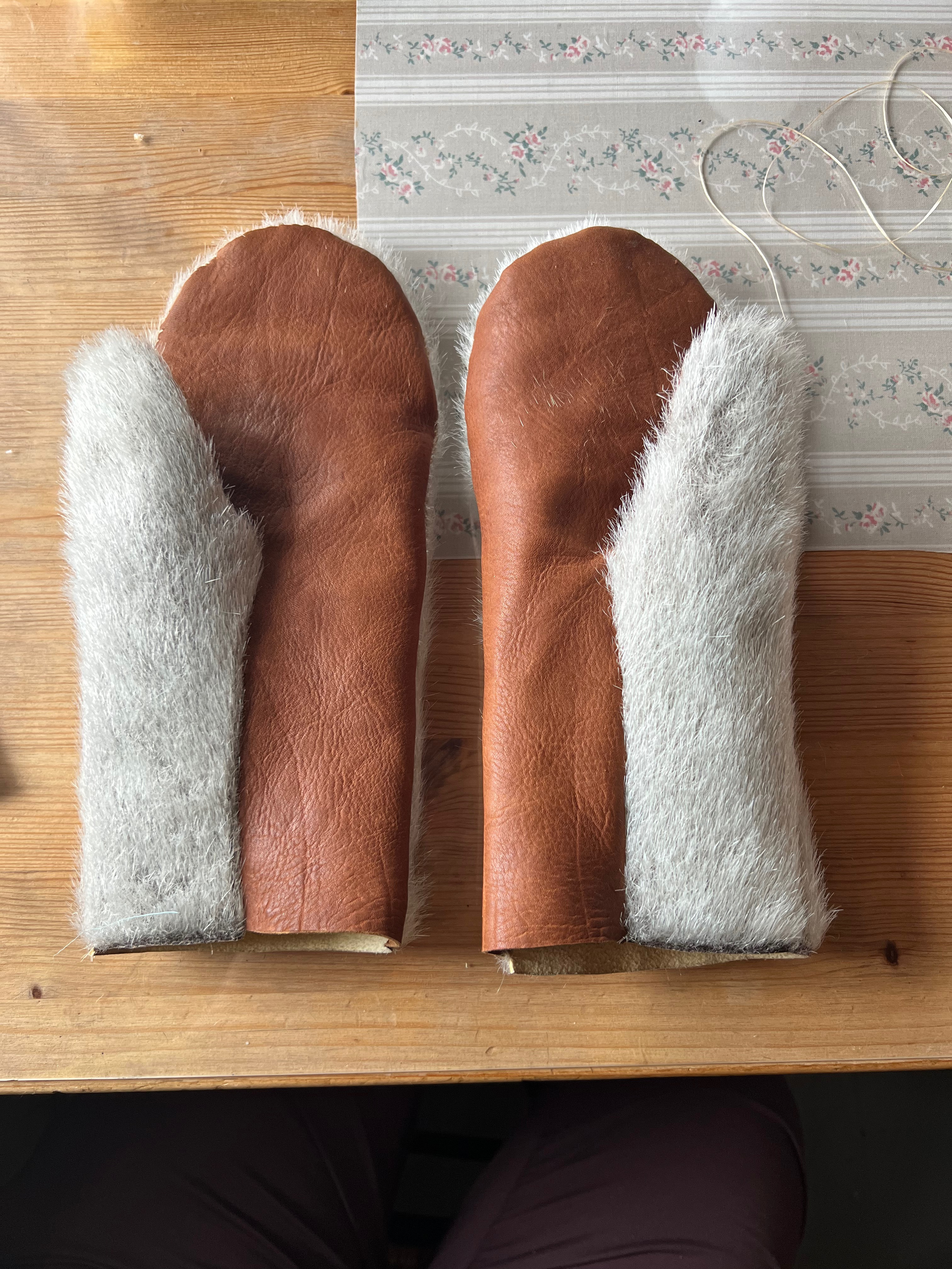 A pair of mittens made of reindeer hide and fur