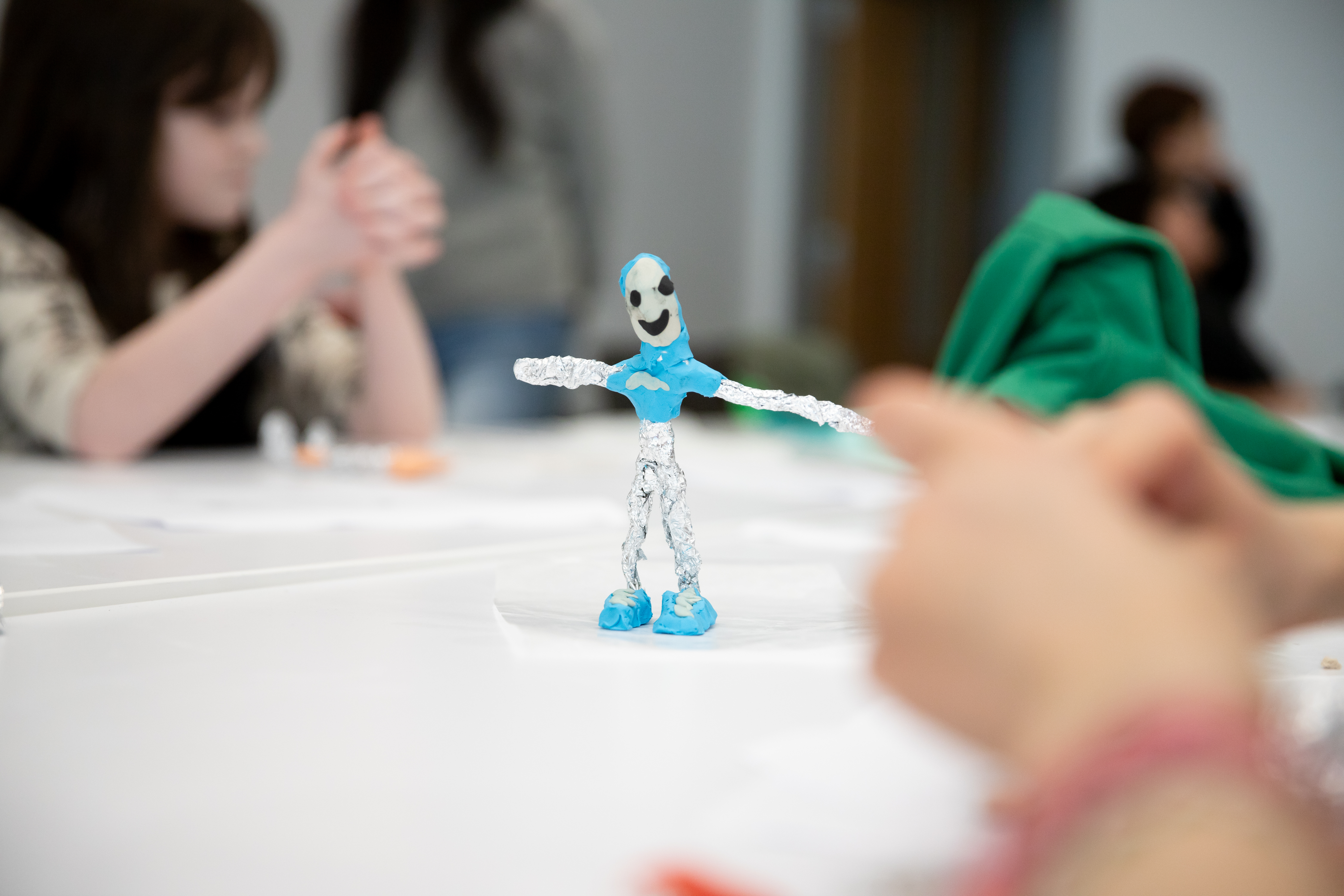A stick figure with blue plasticine