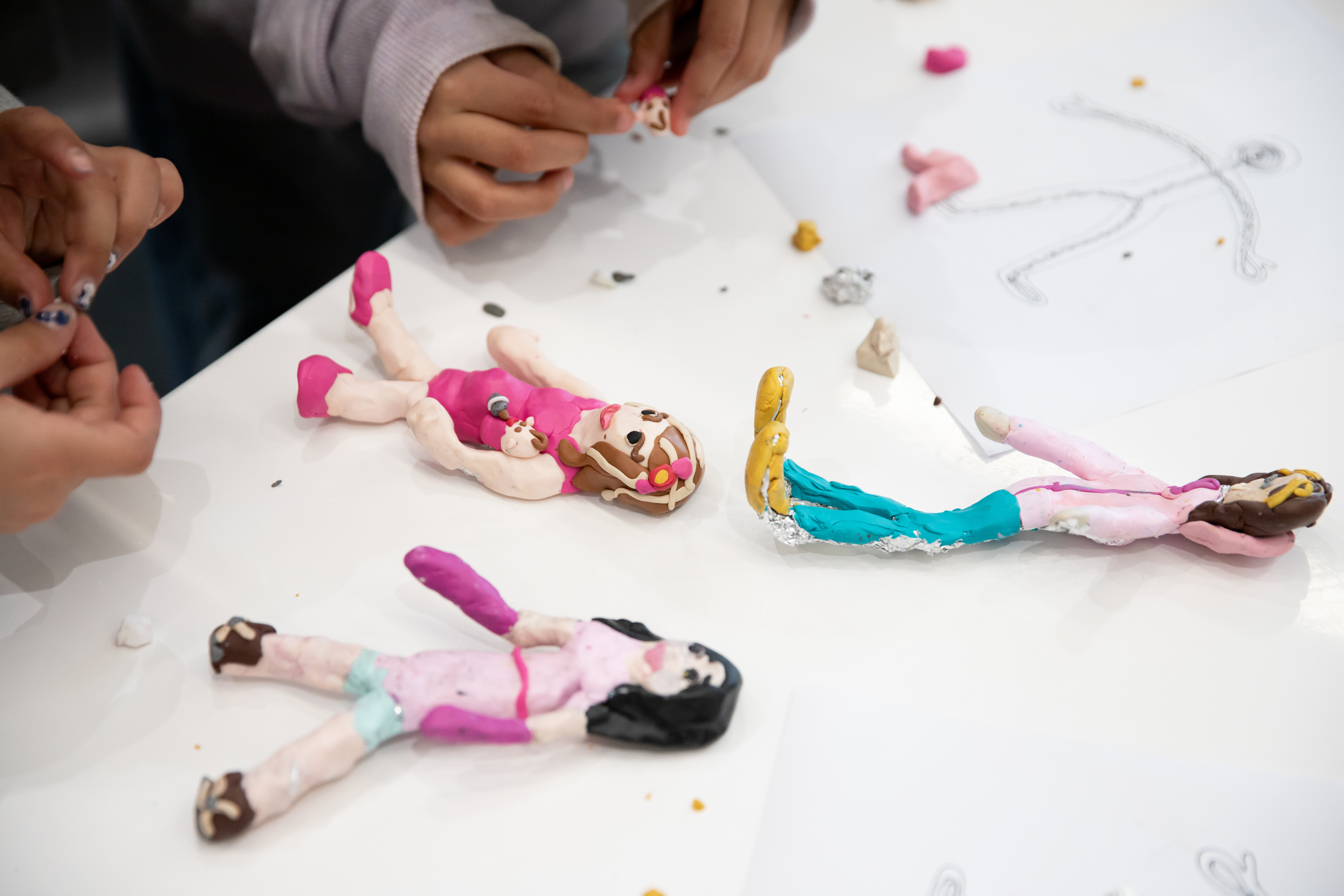 Several colourful puppets on a table