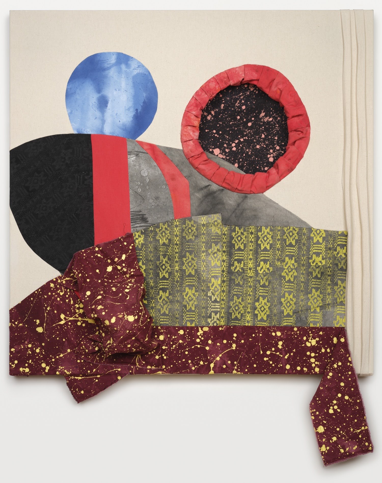 An artwork with different mediums of fiber art and fabric