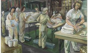Women working in an industrial laundry, folding and handling large white sheets in a busy workshop.