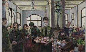 Women in green military uniforms gather in a bright room with tall windows, one carrying a tray of desserts while another writes at a table.