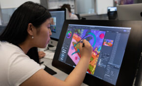 student drawing on a tablet