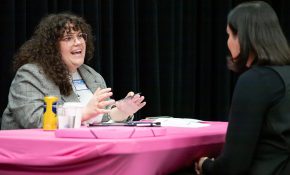 An industry lead using her hands in a chat with a student