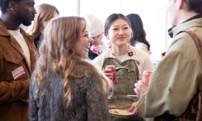 Four students chat at a mixer