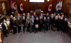 ECU staff, faculty and leadership with the City of Vancouver's Mayor and Council in the council chambers during a proclamation ceremony in honour of the university's centennial.