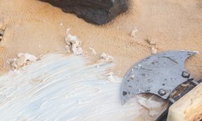 A tan hide with an ulu resting on top of it