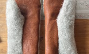 A pair of mittens made of reindeer hide and fur