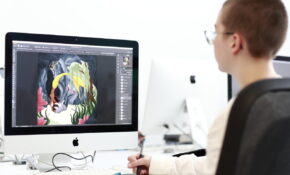 student in front of computer with design file open