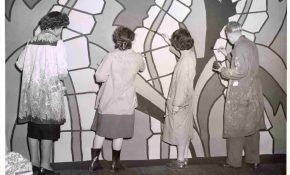 A group of students painting a mural at the Vancouver School of Art.