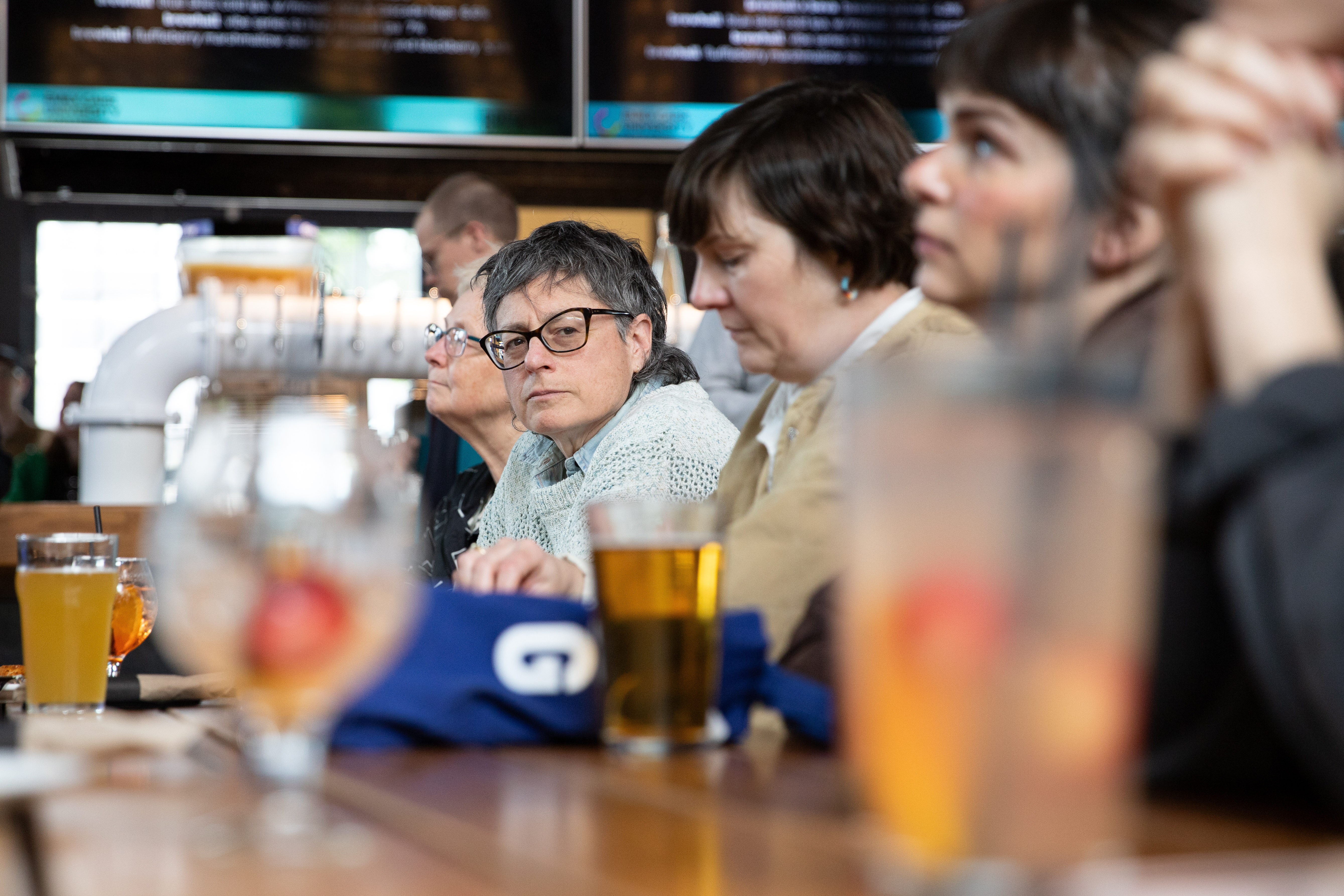 ECU faculty member Randy Lee Cutler sits with colleagues at the ceremony. (Photo by Perrin Grauer)
